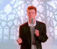 rick-astley-never-gonna-give-you-up Rick Astley cantando y bailando